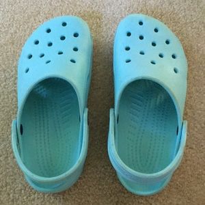 Size 12/13 aqua colored crocs.